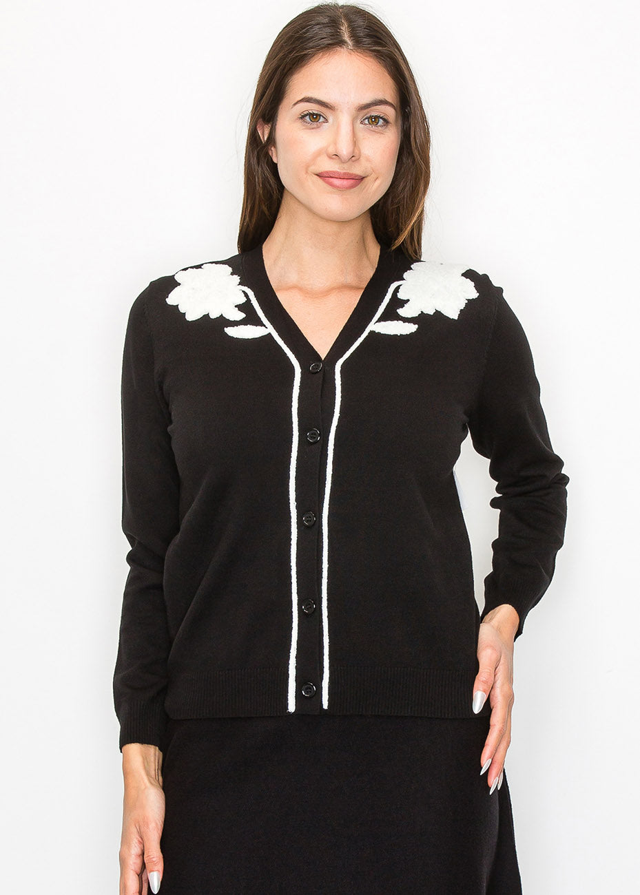 Schwarze und weiße gestickte Strickjacke