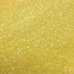 Pastel gelber grober Zucker